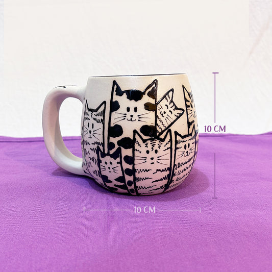 Taza de mishis hambriados